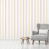 Simple and cozy scandinavian style livingroom interior with grey armchair, pillow, books, cup and twigs in vase on clear white wall background. 3D rendering.